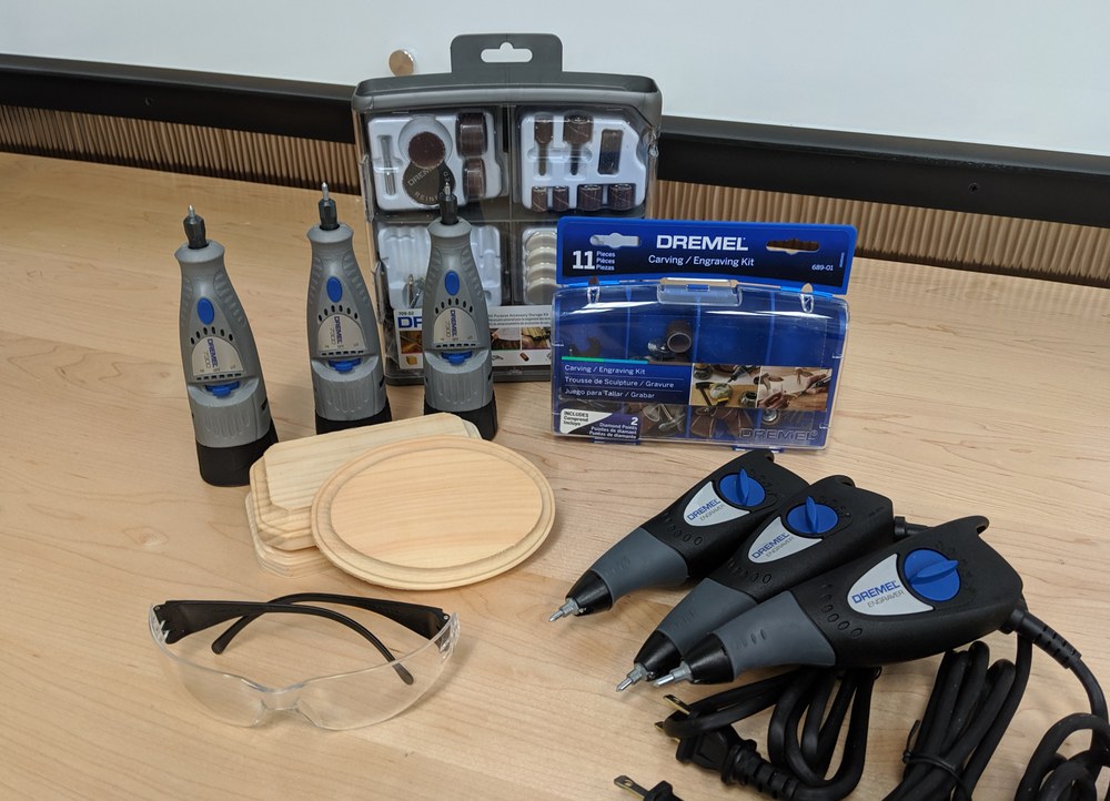 photo of engraving tools, including Dremel rotary tools and engravers